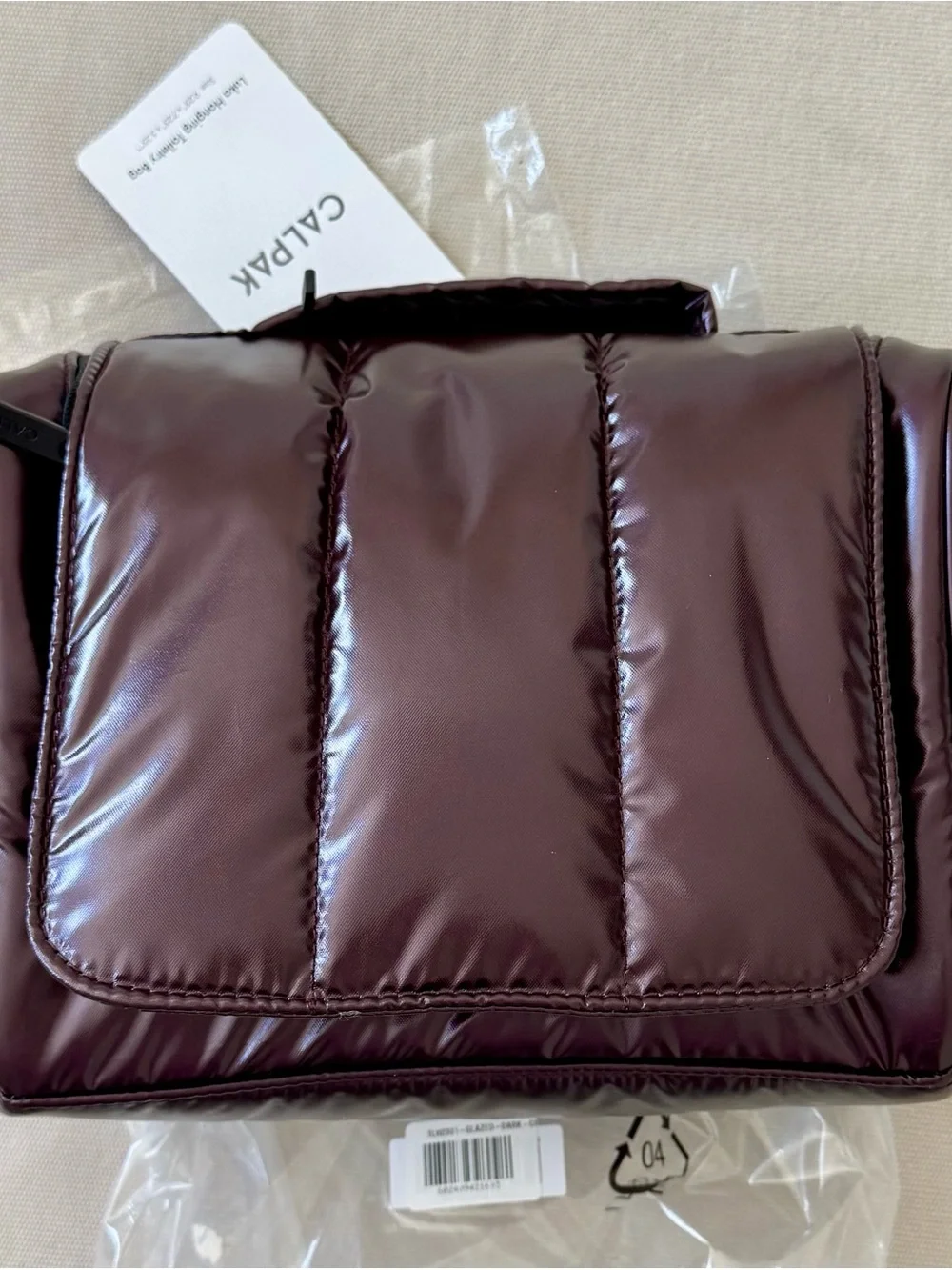 Calpak Luka Hanging Toiletry Bag in Glazed Dark Cherry!